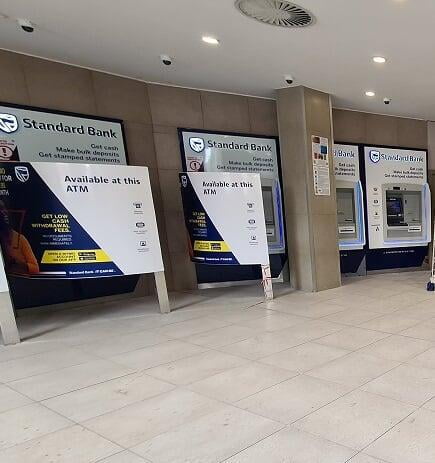 Standard Bank ATM hall with machines installed and signs in place