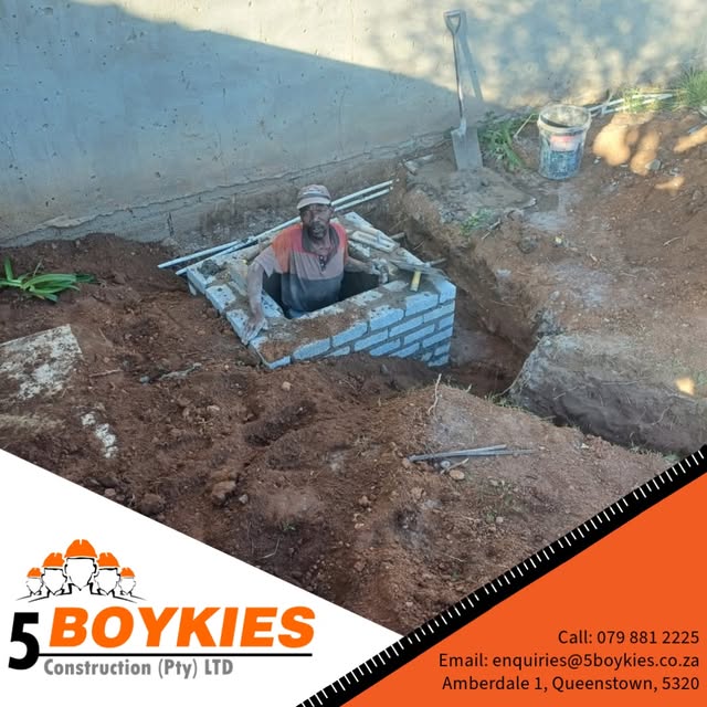 Brick chamber being built in an excavated trench