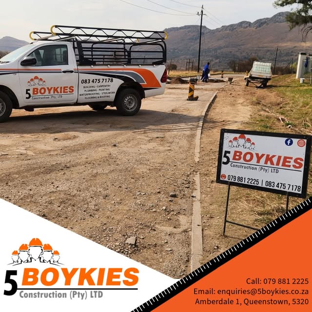 5 Boykies bakkie and site board beside a new kerb and gravel works